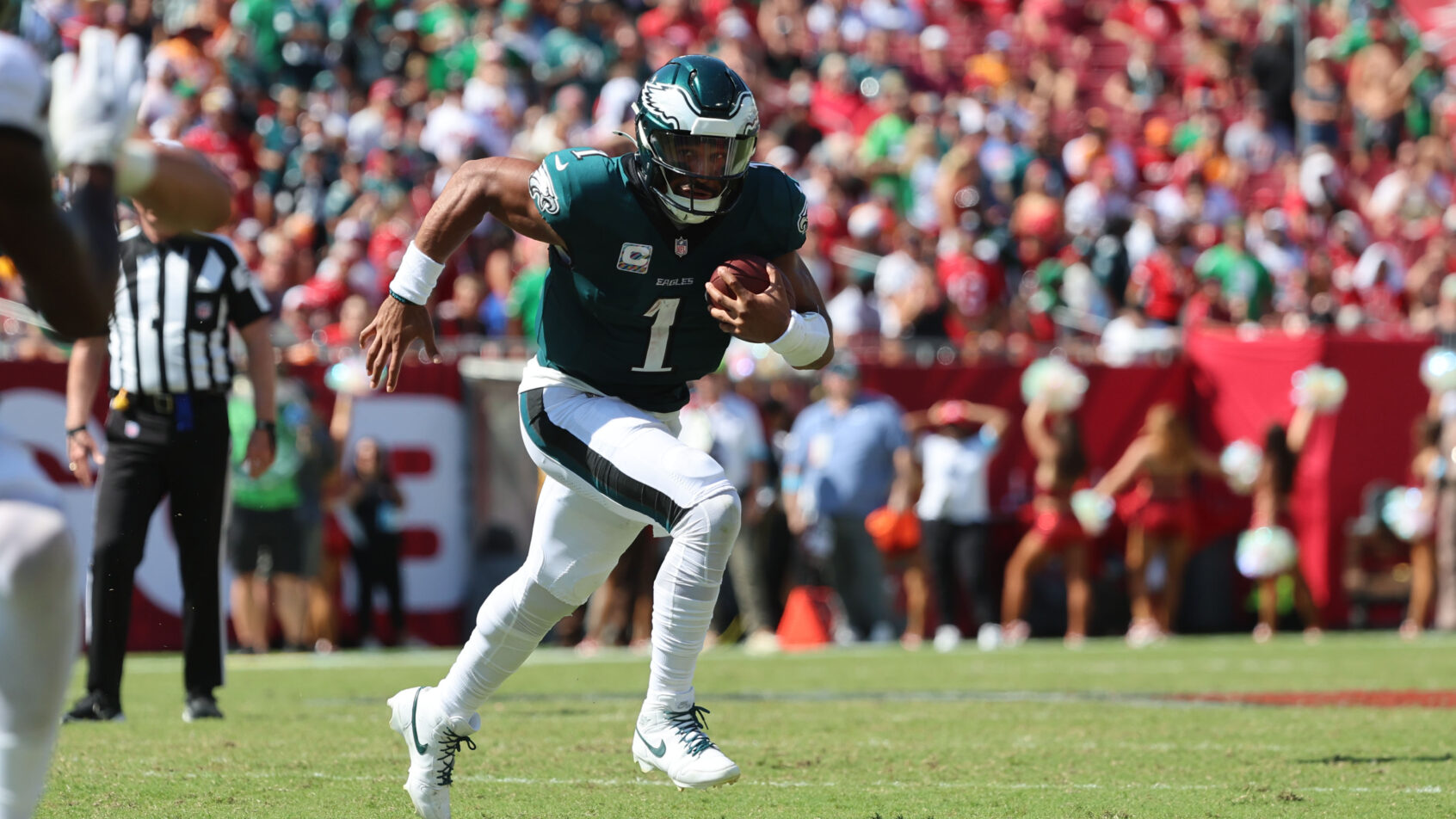 Philadelphia Eagles quarterback Jalen Hurts running with the ball