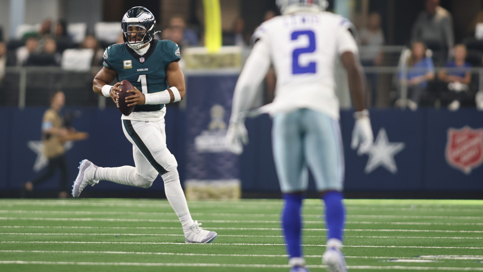 Philadelphia Eagles quarterback Jalen Hurts looks to throw on the run against the Dallas Cowboys