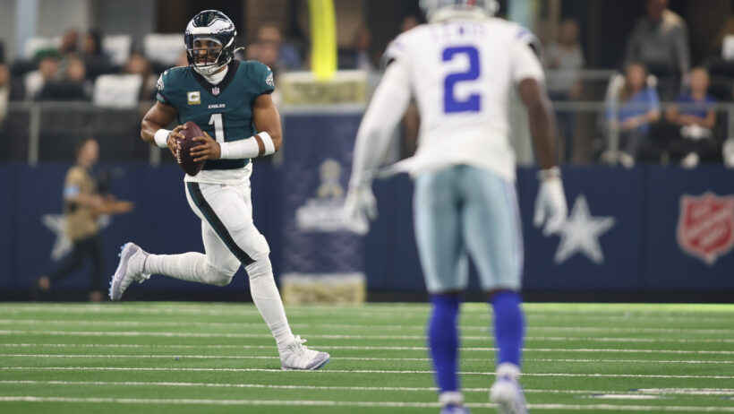 Philadelphia Eagles quarterback Jalen Hurts looks to throw on the run against the Dallas Cowboys