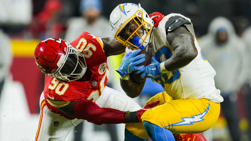 Kansas City Chiefs defensive end Charles Omenihu tackling Los Angeles Chargers running back Kimani Vidal