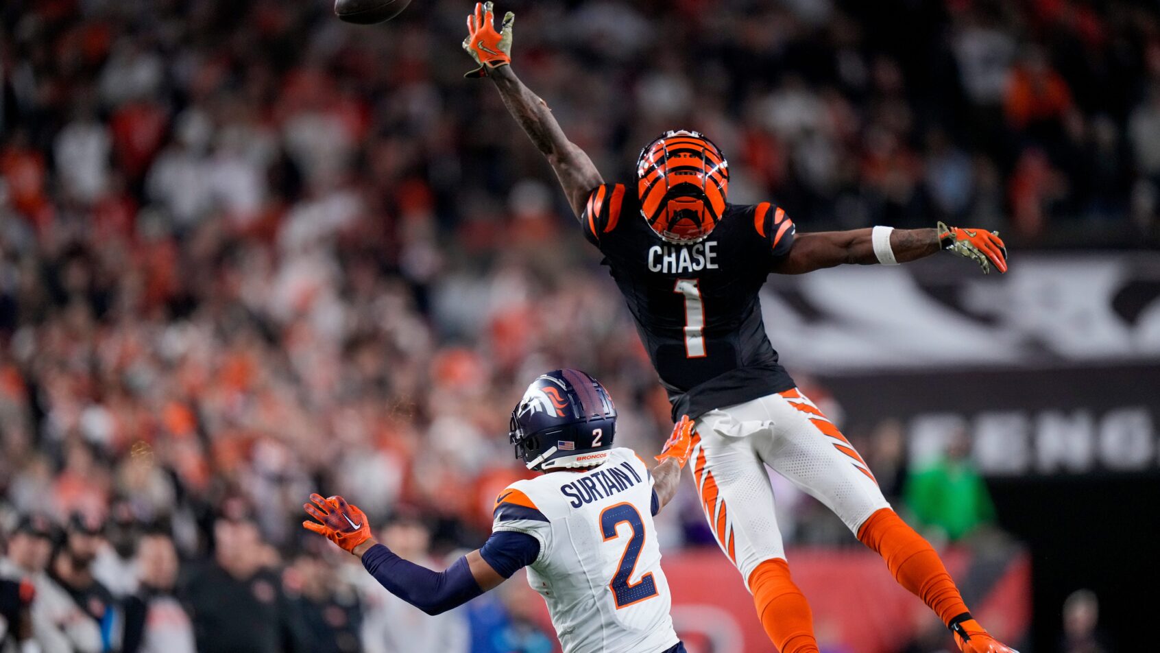 Cincinnati Bengals wide receiver Ja'Marr Chase jumps to catch a pass that's over his head
