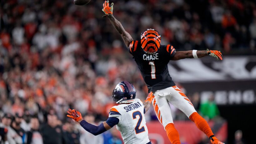 Cincinnati Bengals wide receiver Ja'Marr Chase jumps to catch a pass that's over his head