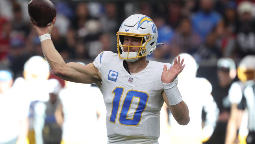 Justin Herbert throwing the ball in the NFL Playoffs