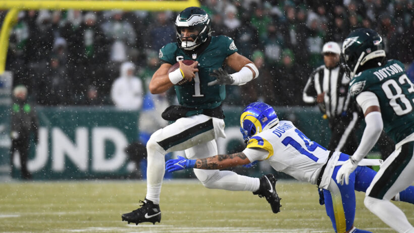 Philadelphia Eagles quarterback Jalen Hurts escapes a tackle by Los Angeles Rams cornerback Cobie Durant