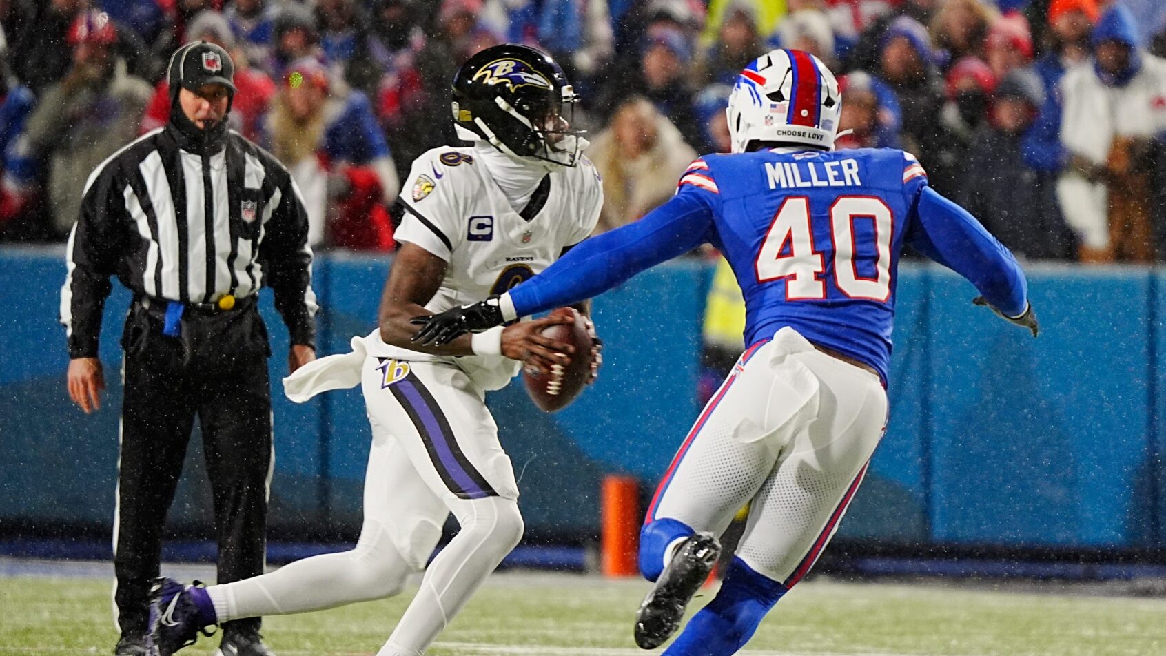 Baltimore Ravens quarterback Lamar Jackson scrambling