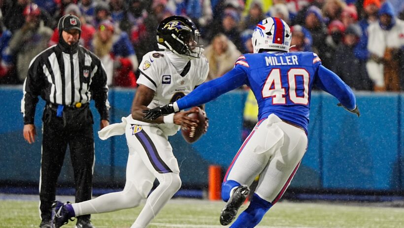 Baltimore Ravens quarterback Lamar Jackson scrambling