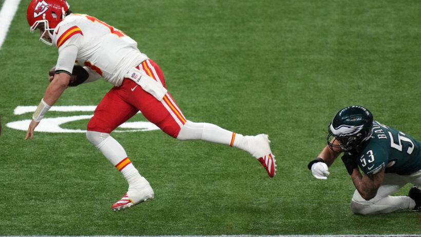 Philadelphia Eagles linebacker Zack Baun tackling Kansas City Chiefs quarterback Patrick Mahomes