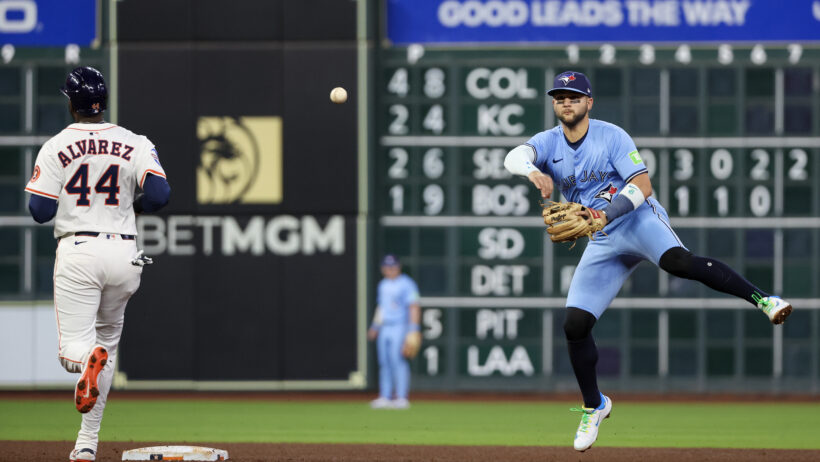 Toronto Blue Jays shortstop Bo Bichette throws to first against the Houston Astros