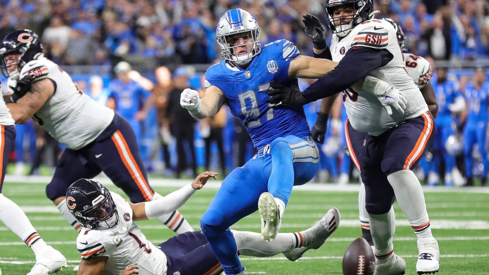 Detroit Lions defensive end Aidan Hutchinson chases after a fumble