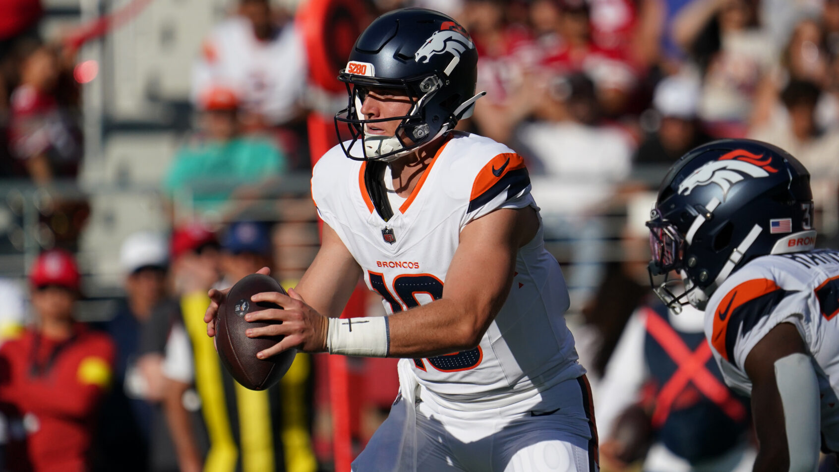 Bo Nix receiving a snap