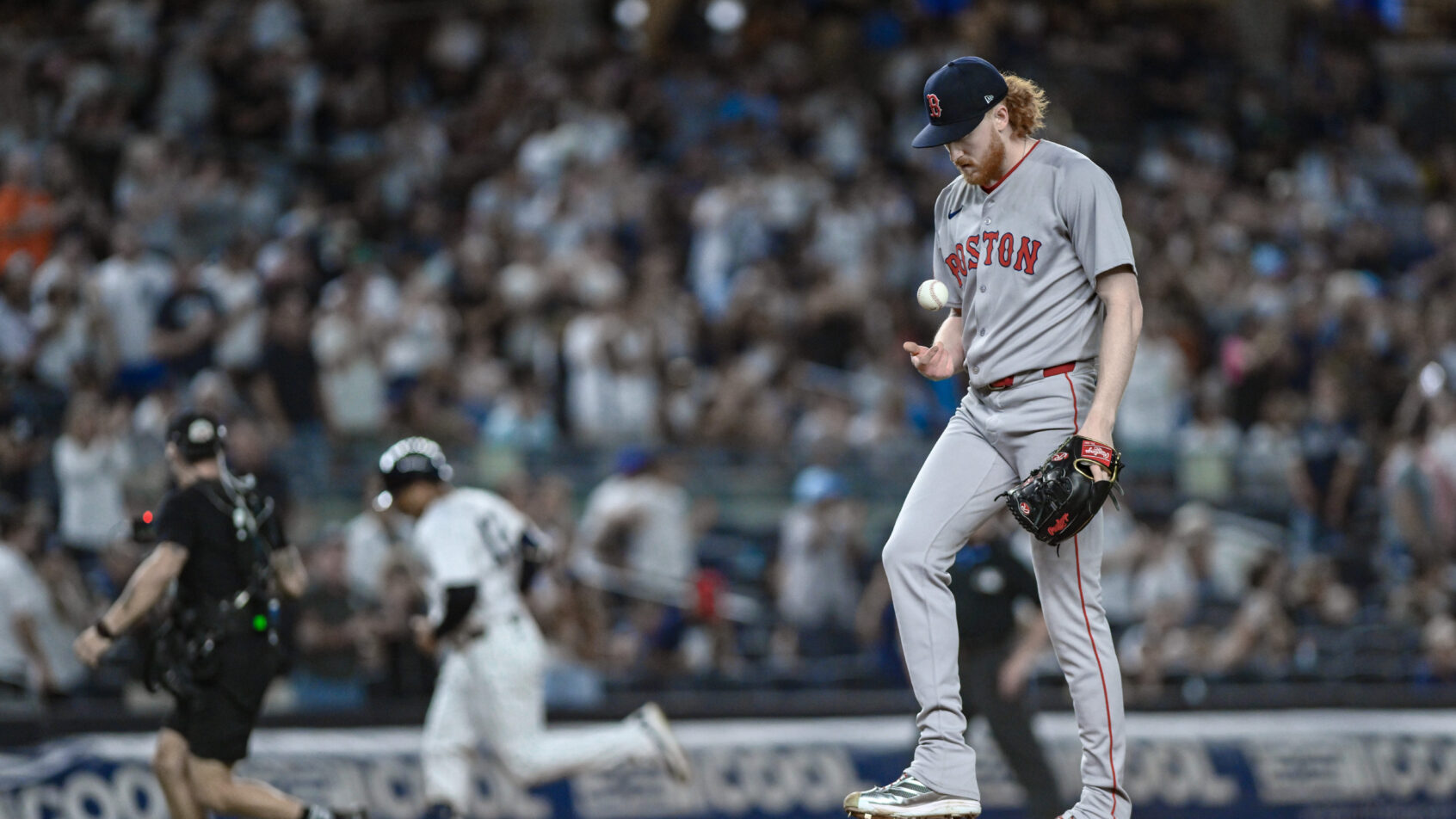 Boston Red Sox pitcher Garrett Crochet looks down at the mound after giving up a home run against the New York Yankees