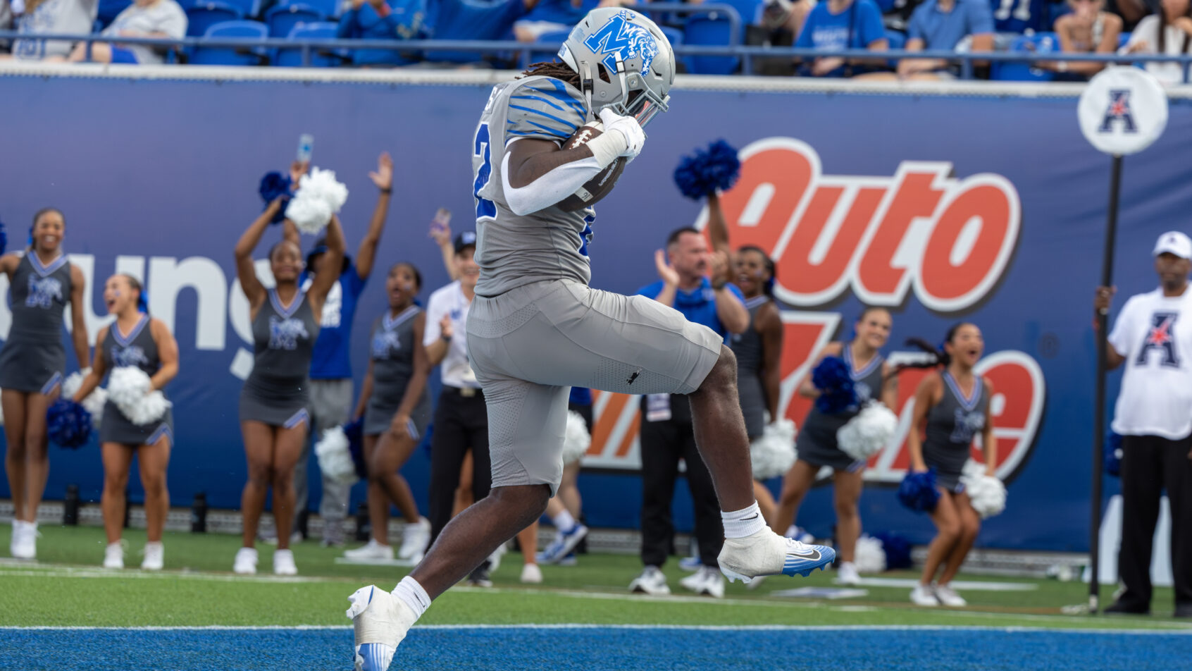 Memphis running back Frank Peasant celebrating in the endzone