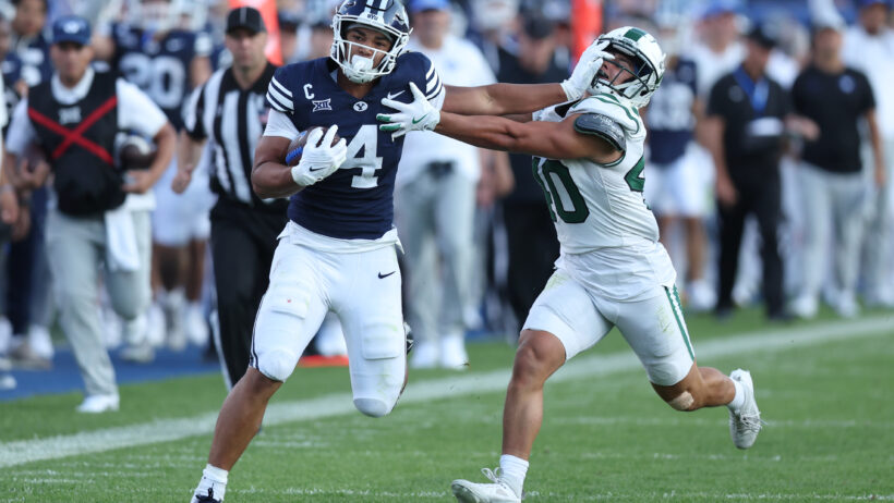 LJ Martin dishes out a nasty stiff arm to a Portland State defender.