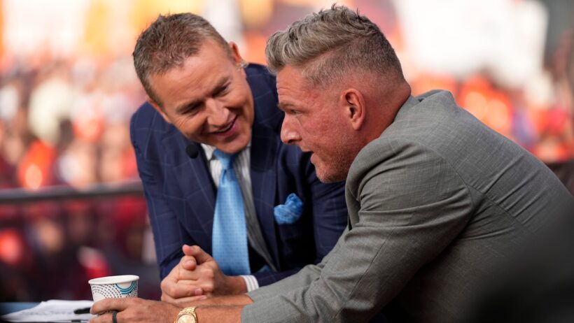 Pat McAfee talks to Kirk Herbstreit on the set of ESPN College GameDay