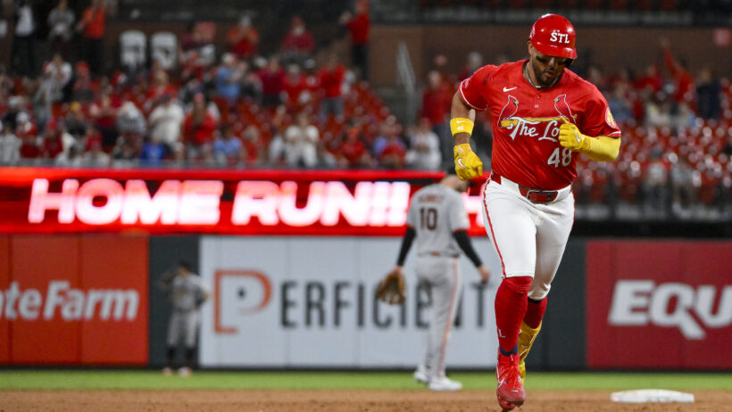 Ivan Herrera rounding the bases after hitting a home run