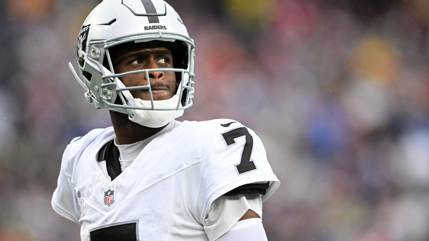 Geno Smith looks on in a game versus the Patriots.