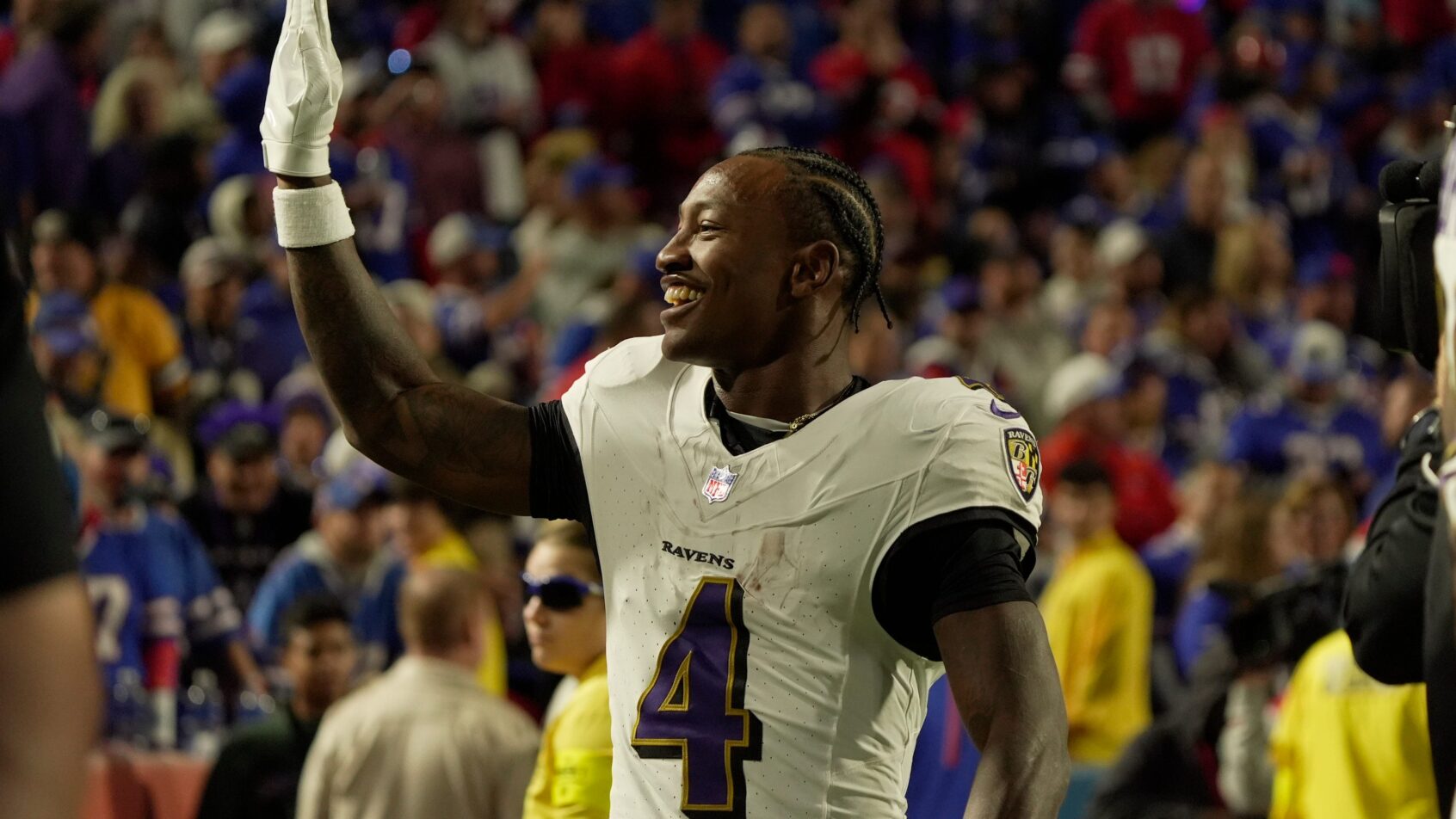 Zay Flowers waving to fans after scoring a touchdown
