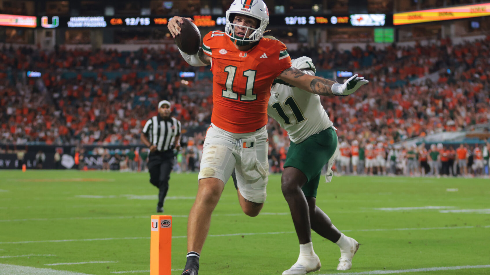 Miami Hurricanes quarterback Carson Beck scoring a rushing TD against USF