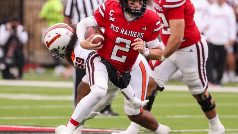 Texas Tech's Behren Morton runs with football