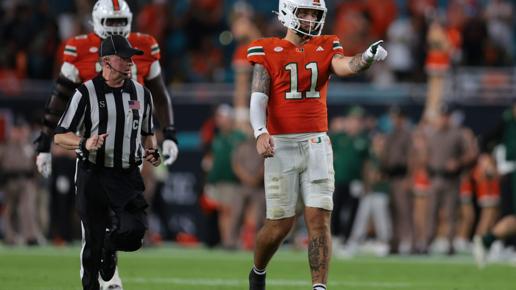 Miami Hurricanes quarterback Carson Beck reacts on the field