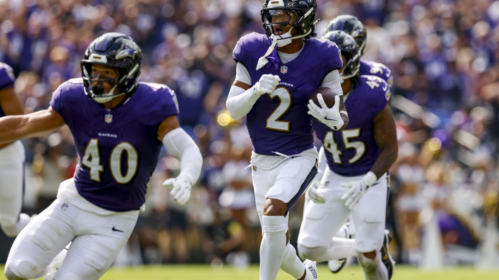 Baltimore Ravens cornerback Nate Wiggins returning an interception