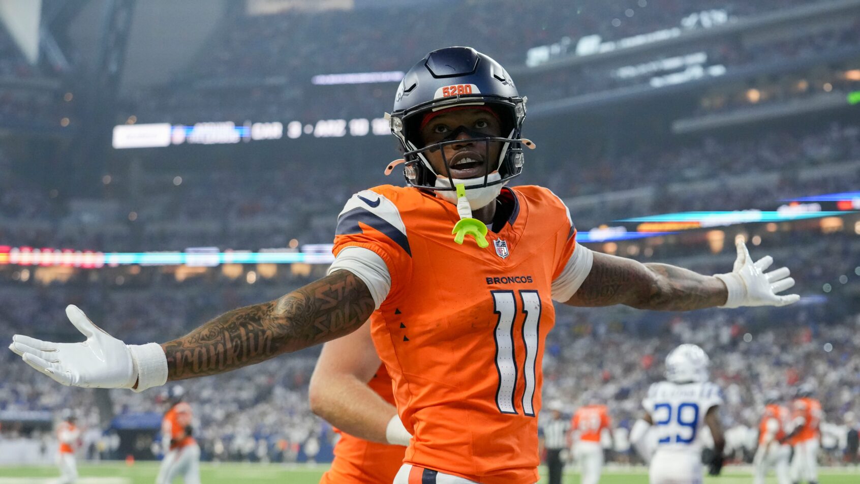 Troy Franklin celebrates after scoring a touchdown