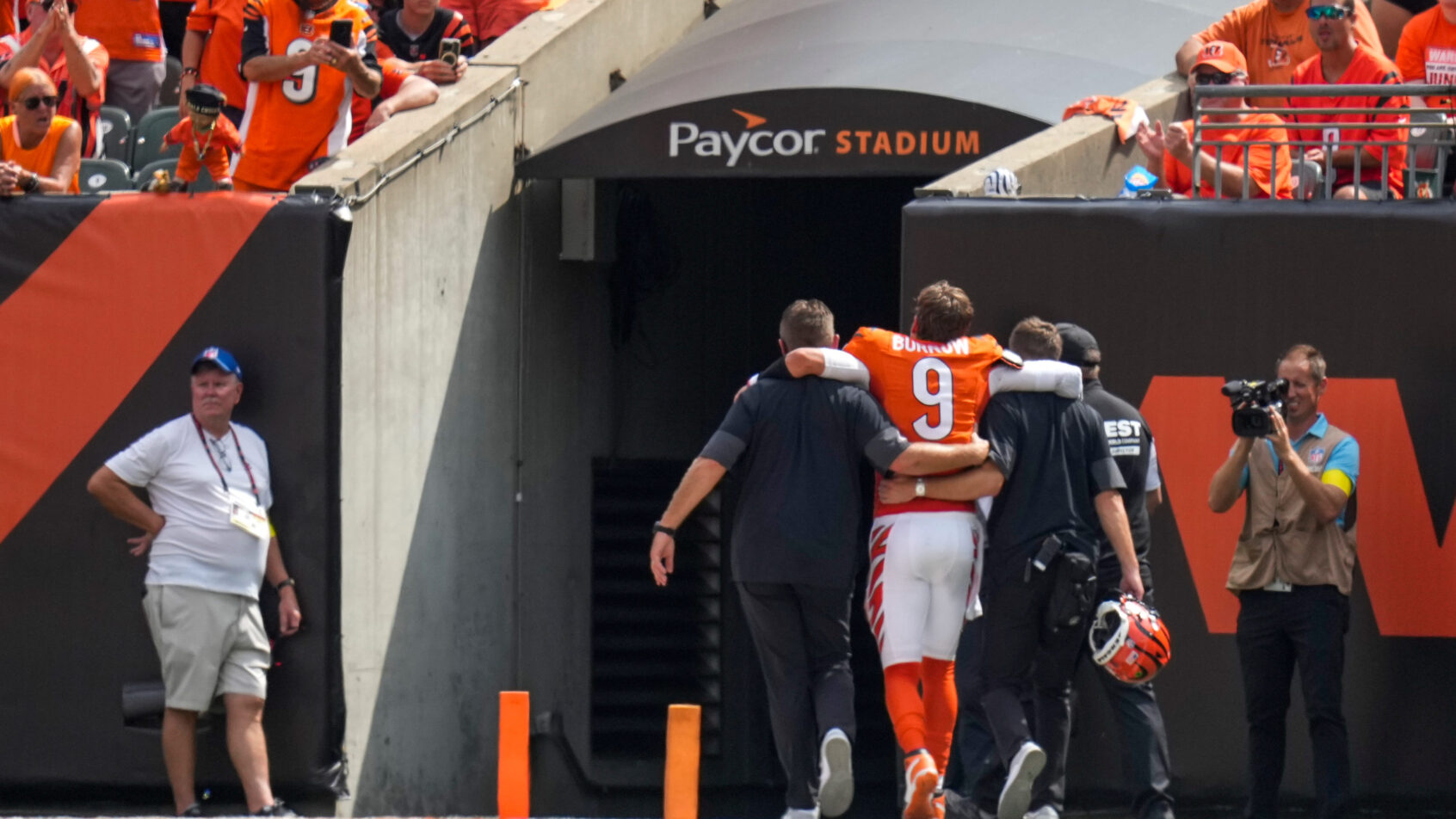 Cincinnati Bengals quarterback Joe Burrow is helped off the field after suffering a toe injury