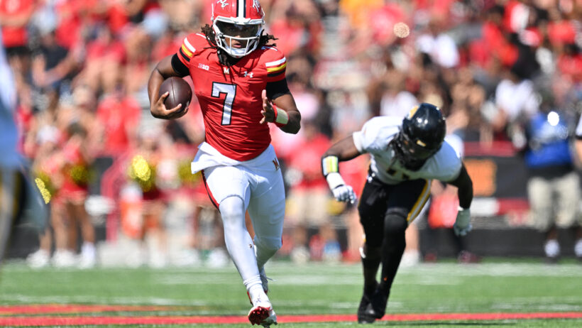 Maryland Terrapins quarterback Malik Washington runs with the ball