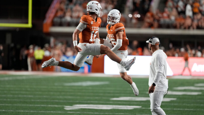 Arch Manning leaping celebration with Michael Taaffe