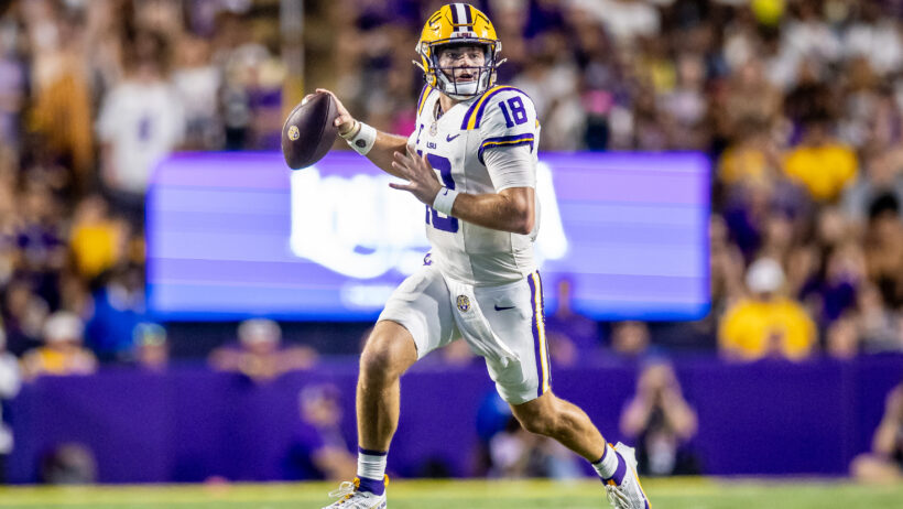 LSU Tigers quarterback Garrett Nussmeier scrambles