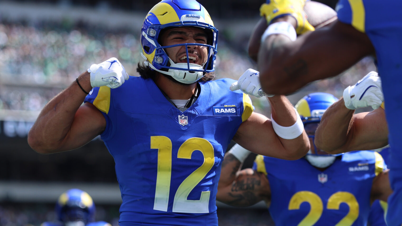 Los Angeles Rams wide receiver Puka Nacua flexes in the end zone