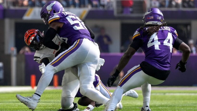 Isaiah Rodgers wraps up Noah Fant during a Vikings win over the Bengals.