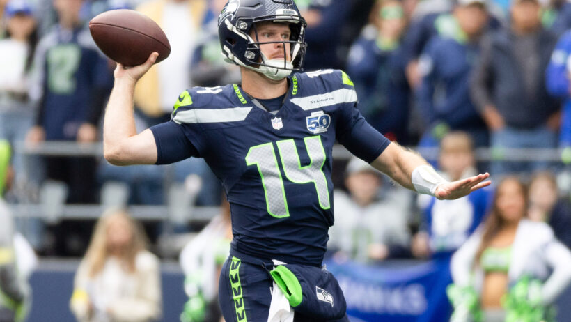 Sam Darnold throws on the run versus the Saints.