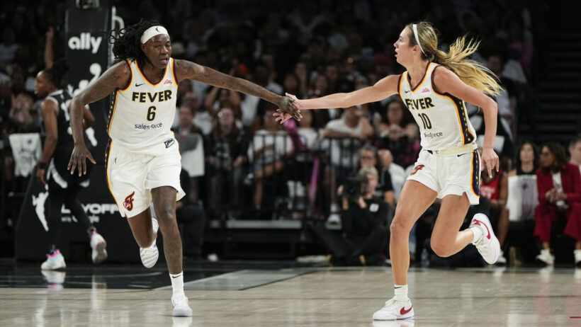 Indiana Fever guard Lexie Hull and forward Natasha Howard high-five after a basket