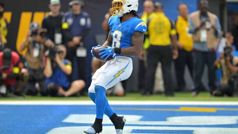 Omarion Hampton with the ball in the endzone