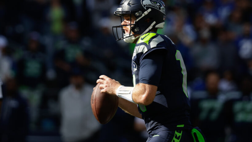 Sam Darnold drops back to pass