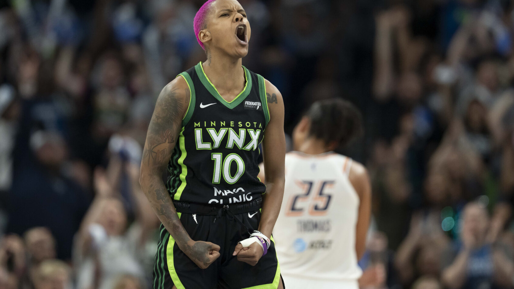 Minnesota Lynx guard Courtney Williams celebrates a basket