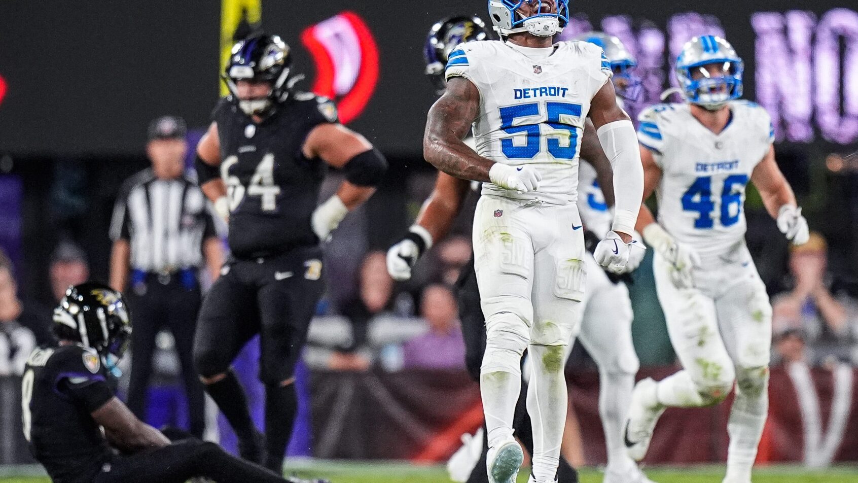 Detroit Lions linebacker Derrick Barnes celebrating after a sack