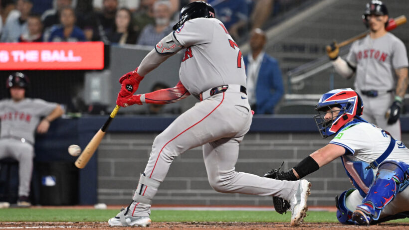 Boston Red Sox catcher Carlos Narvaez hitting a double against the Toronto Blue Jays