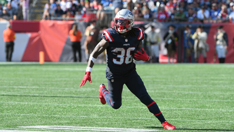 New England Patriots running back Rhamondre Stevenson runs the ball