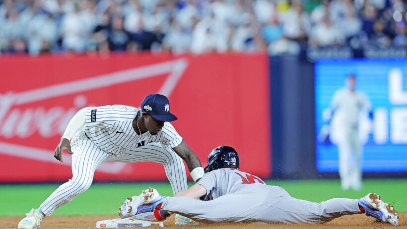 Boston Red Sox shortstop Trevor Story gets tagged out at second