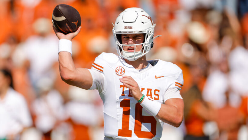 Texas Longhorns quarterback Arch Manning warms up
