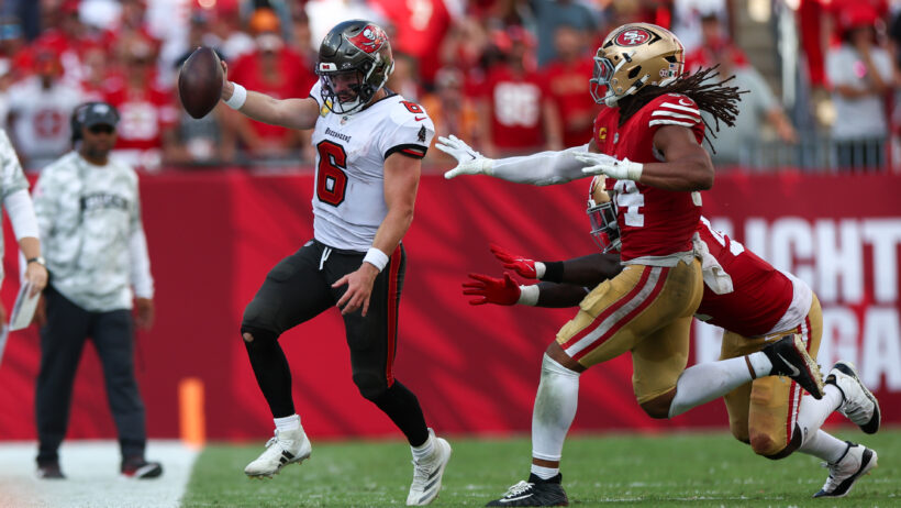 Tampa Bay Buccaneers quarterback Baker Mayfield running with the ball against the San Francisco 49ers