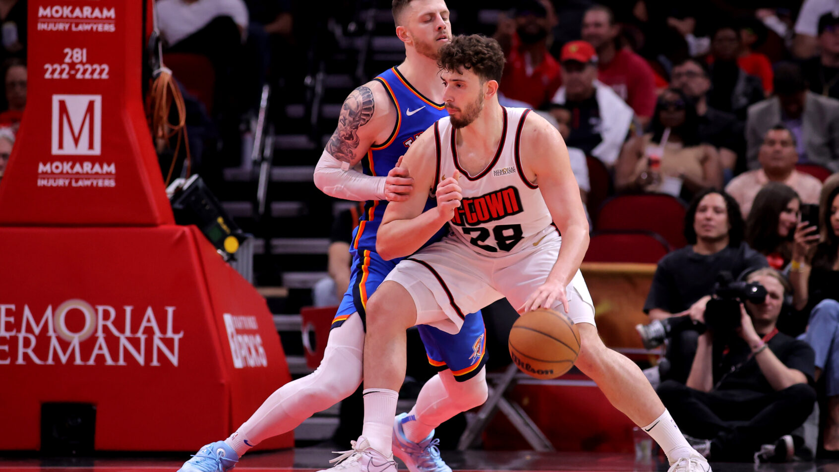 Houston Rockets center Alperen Sengun posts up against Oklahoma City Thunder center Isaiah Hartenstein