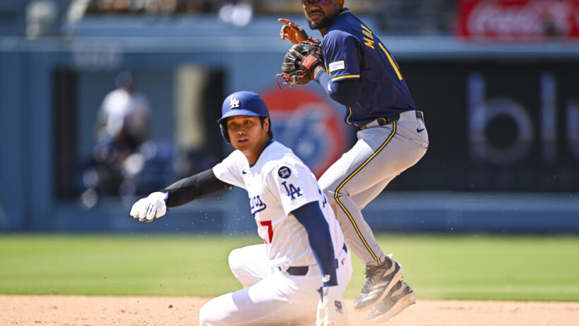 Los Angeles Dodgers two-way player Shohei Ohtani slides into second base against the Milwaukee Brewers