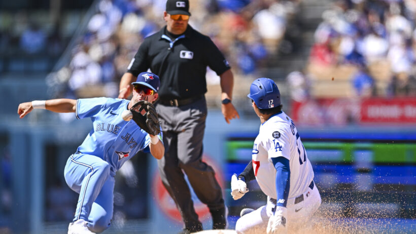 Los Angeles Dodgers designated hitter Shohei Ohtani steals second as Toronto Blue Jays second baseman Ernie Clement covers the bag