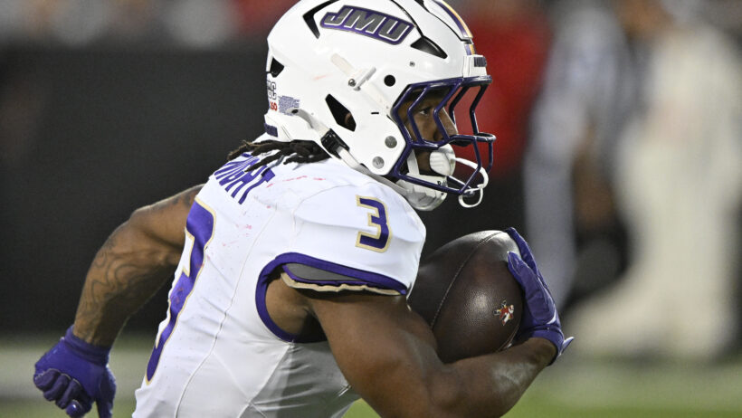 Wayne Knight carries the ball for JMU vs Louisville.