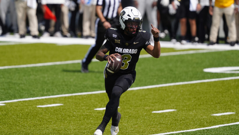 Kaidon Salter running with football
