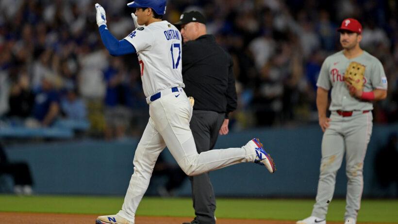 Los Angeles Dodgers designated hitter Shohei Ohtani rounds the bases after hitting a home run