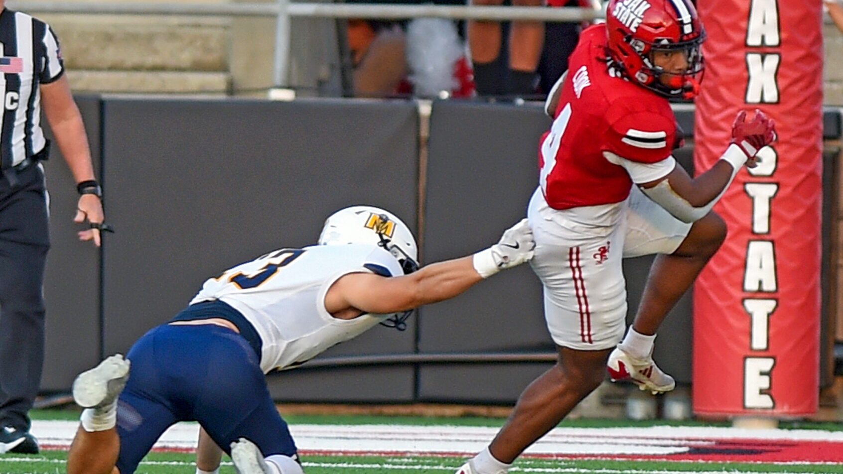 Cam Cook breaking tackle